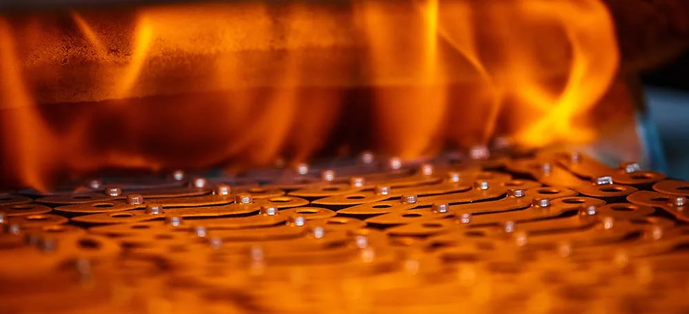 Steel parts glowing inside UTEC Industrial's heat treating furnace