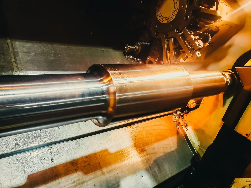CNC lathe turning a precision shaft at UTEC Industrial
